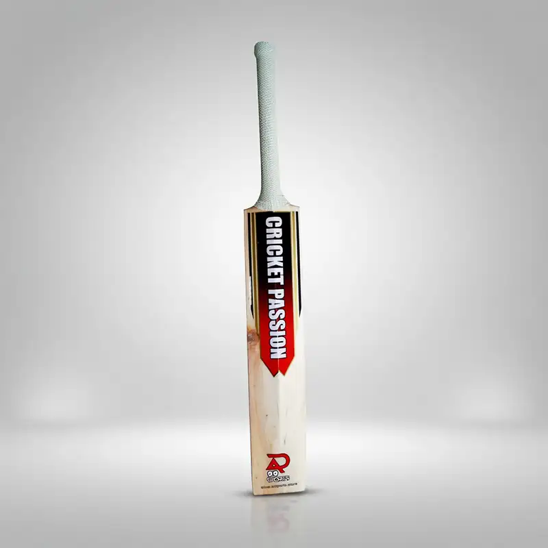 AR Sports Cricket Passion Edition English WillowBat AR Sports Cricket Passion Edition English Willow cricket bat standing upright against a clean light gray studio background. The bat has a light natural wood blade with visible grain, a long handle covered in a textured light-colored grip, and a bold black, red, and white “CRICKET PASSION” design running vertically along the front of the blade. The AR Sports logo is printed near the bottom of the bat, with a soft shadow and subtle reflection visible beneath it. The image showcases the AR Sports Cricket Passion Edition English Willow Bat, available for purchase with delivery across Pakistan.