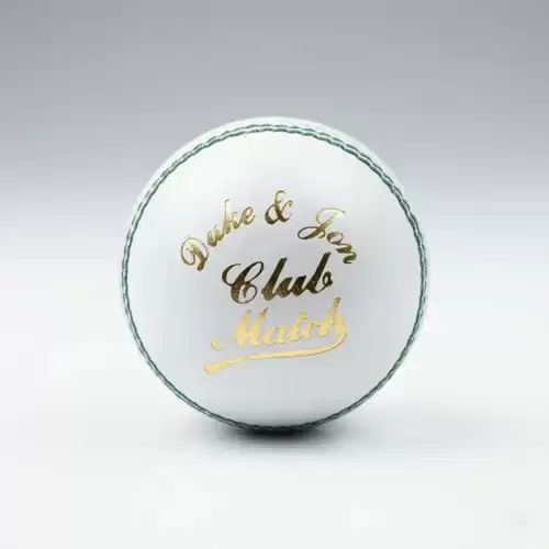Dukes White Color Hard Ball shown against a clean light gray studio background. The white leather cricket ball is positioned upright in the center, with its raised stitched seam clearly visible around the outer edge. The front of the ball features the “Dukes & Sons Club Match” branding in gold and black lettering, while the green stitching around the seam creates a visible contrast against the white leather surface. The ball has a traditional hard cricket ball shape and 4-piece stitched construction. Soft studio lighting creates a subtle shadow underneath the ball and highlights its smooth leather finish. The image showcases the Dukes White Color Hard Ball, available for online delivery across Pakistan.