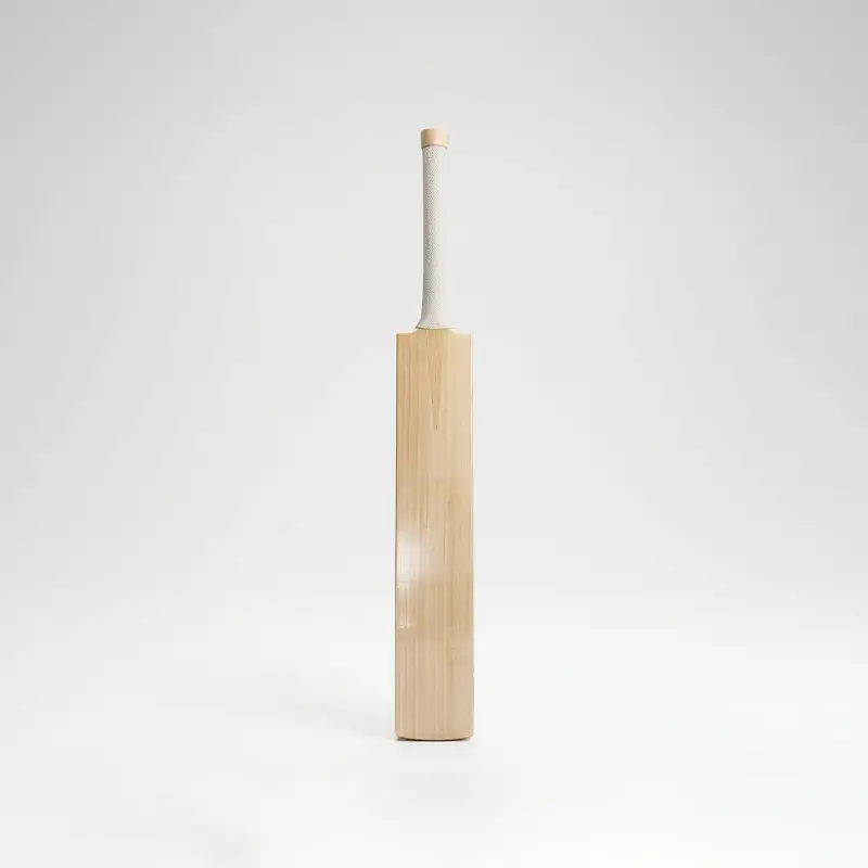 English Willow Cricket Bat 98 Edition AR Sports English Willow Cricket Bat – 98 Edition standing upright against a clean white studio background. The bat has a light natural wood blade with subtle vertical grain patterns, a long white textured grip on the handle, and a plain front face with minimal visible branding or graphics. Its straight, traditional cricket-bat profile and smooth natural wood finish are clearly visible, with soft studio lighting creating a gentle shadow and reflection beneath the bat. The image showcases the AR Sports English Willow Cricket Bat – 98 Edition, available in Pakistan.